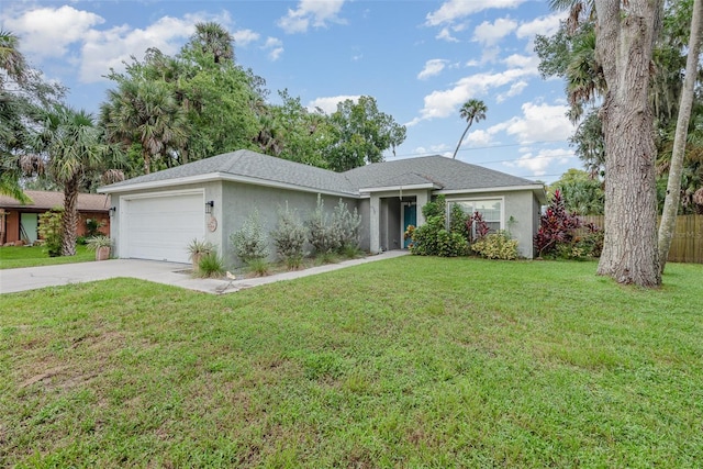 ranch-style house featuring a garage and a front lawn