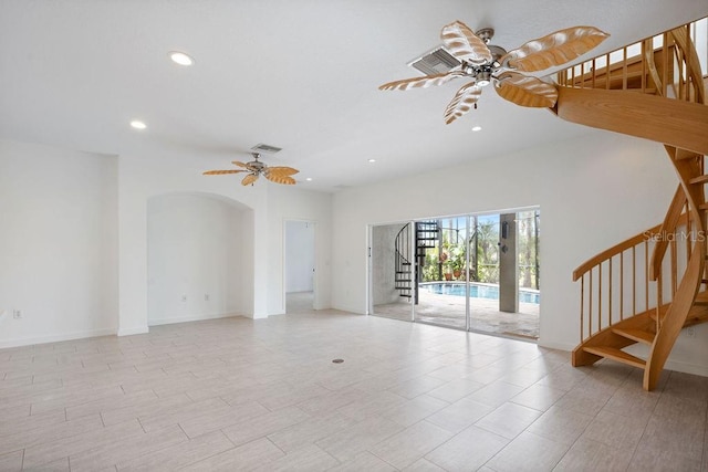 unfurnished living room featuring light wood-type flooring and ceiling fan