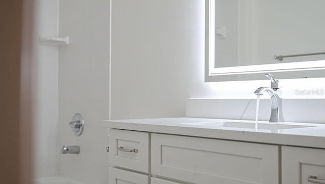 full bathroom featuring vanity and walk in shower