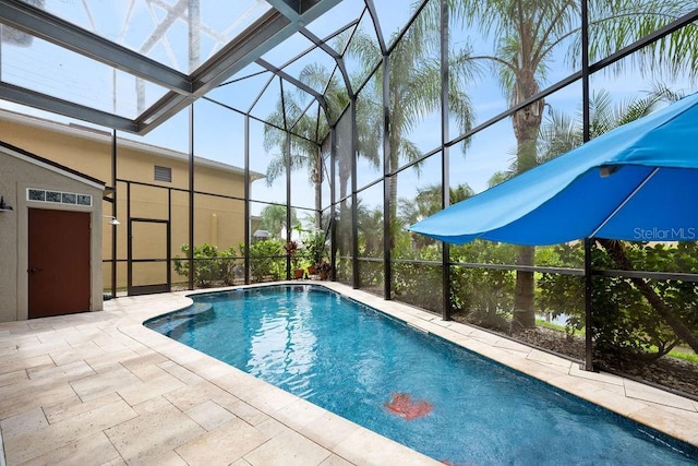 pool featuring a lanai and a patio area