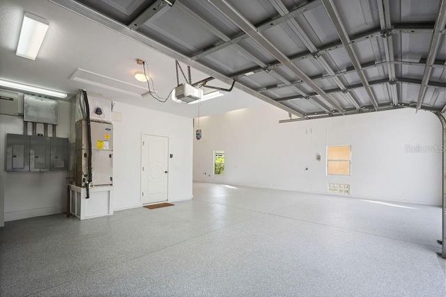 garage with electric panel and a garage door opener
