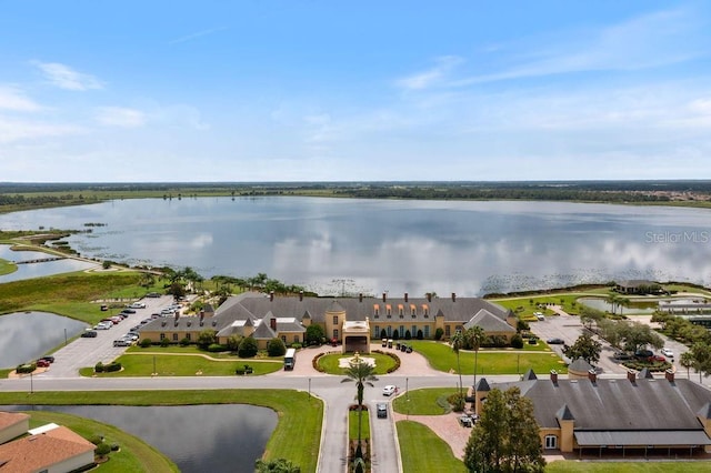 birds eye view of property with a water view