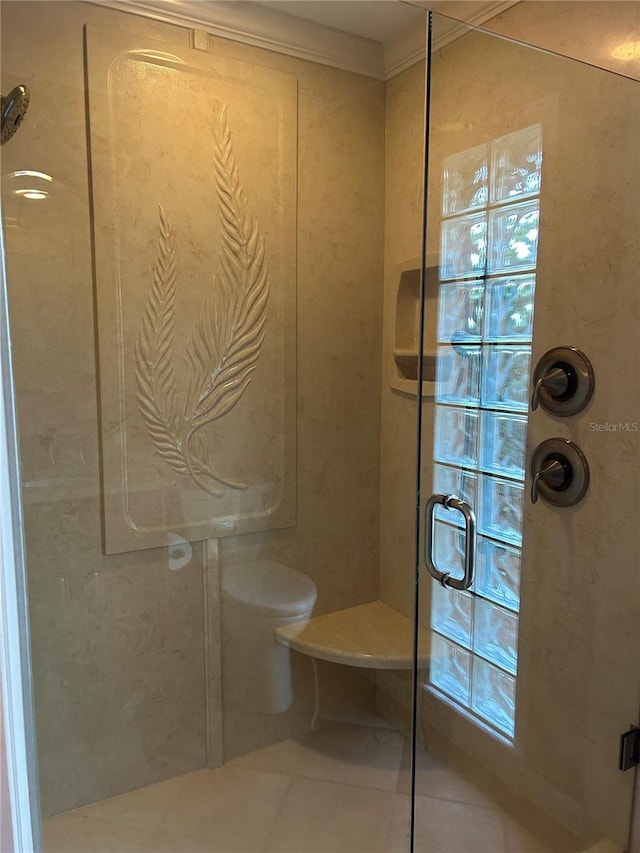 full bathroom with toilet, ornamental molding, a shower with door, and tile patterned floors