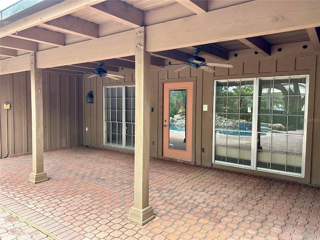 property entrance with a patio area and ceiling fan