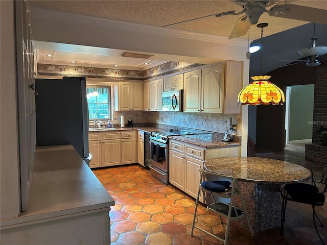 kitchen featuring a textured ceiling, ceiling fan, stainless steel appliances, decorative backsplash, and light brown cabinetry