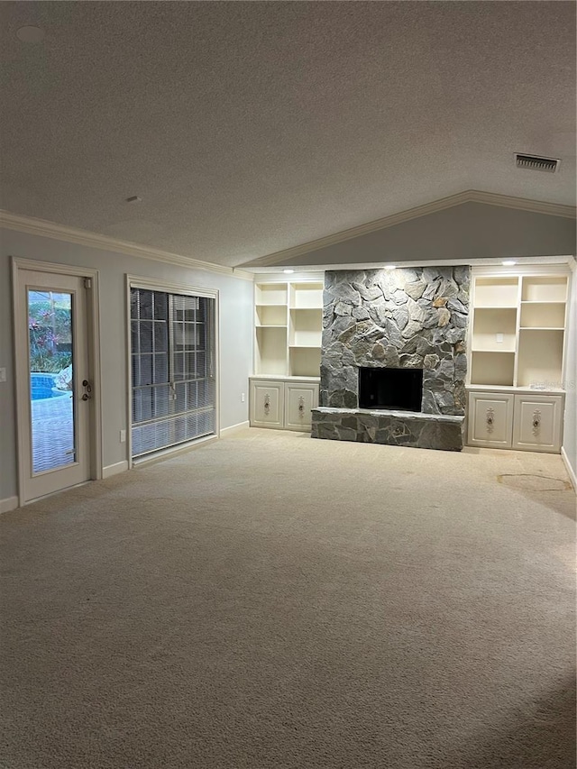 unfurnished living room featuring a textured ceiling, carpet floors, vaulted ceiling, and crown molding