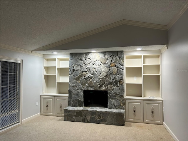 living area with crown molding, carpet flooring, vaulted ceiling, and a stone fireplace