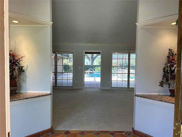 interior space featuring baseboards and ornamental molding