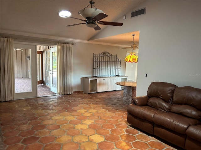 living room with high vaulted ceiling, a ceiling fan, visible vents, and crown molding