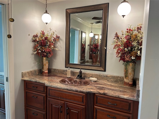 bathroom with crown molding and vanity