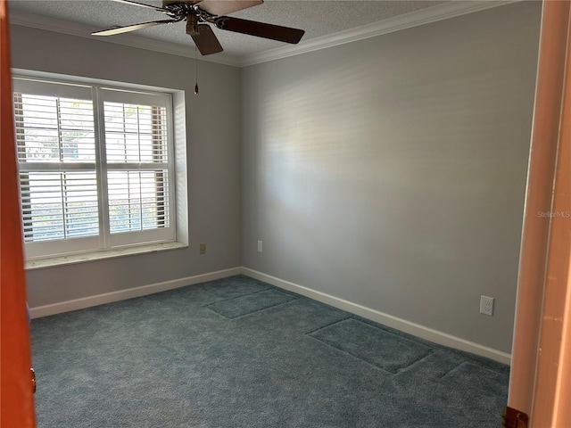 spare room with crown molding, dark carpet, a textured ceiling, and baseboards