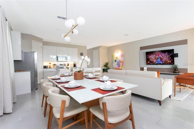 dining room featuring light tile patterned flooring