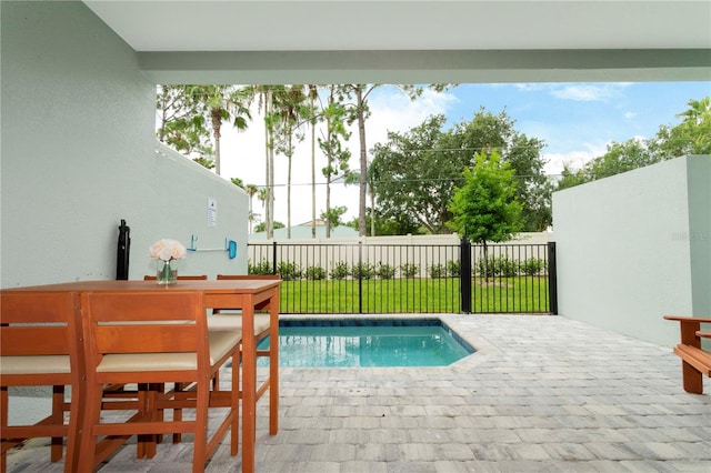 view of pool with a lawn and a patio area