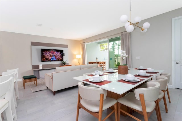 dining space featuring an inviting chandelier