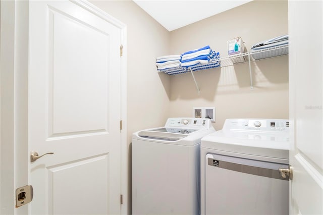 laundry room with independent washer and dryer