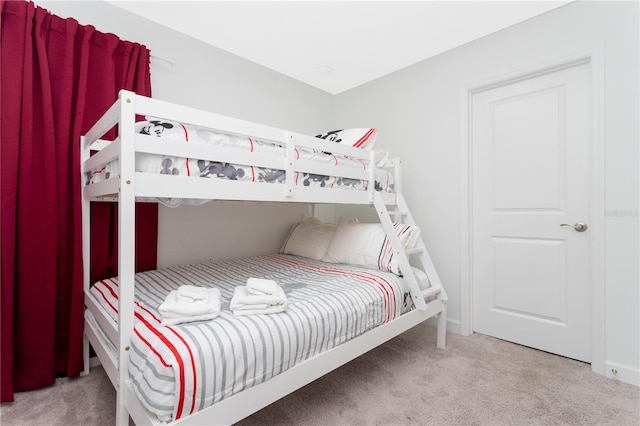 bedroom featuring light colored carpet