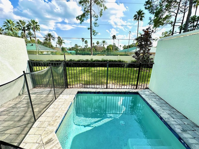 view of pool with a yard, a fenced in pool, and fence