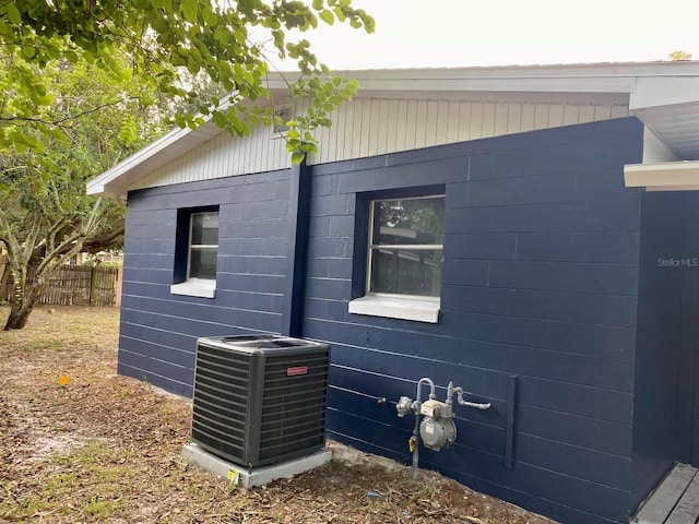 view of side of property featuring central AC