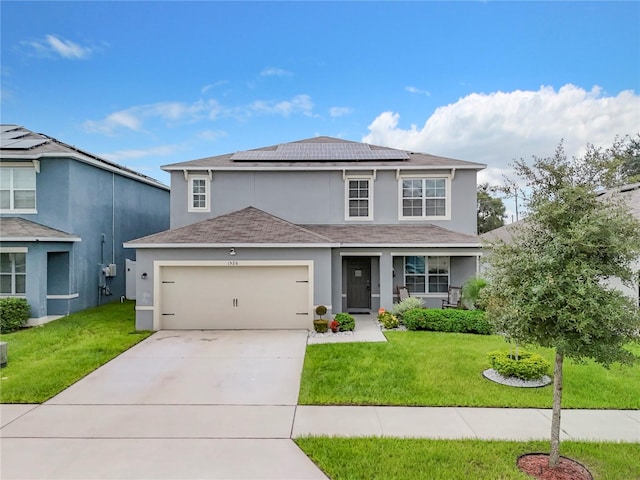 view of front property featuring a garage, solar panels, and a front lawn