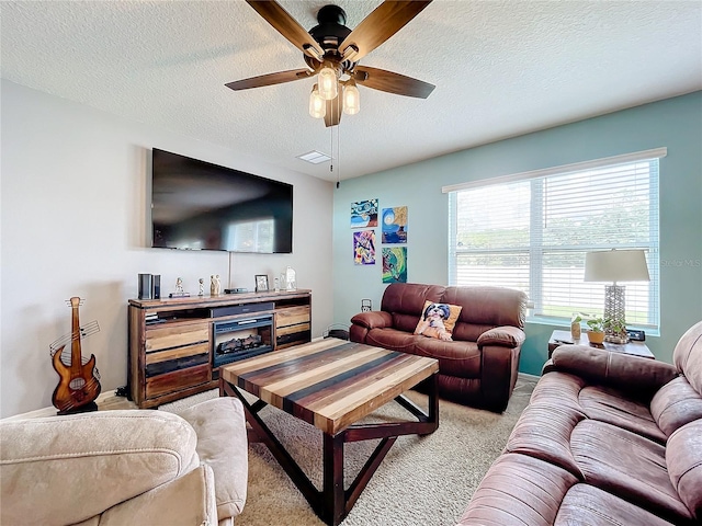 living room with light carpet, ceiling fan, and plenty of natural light