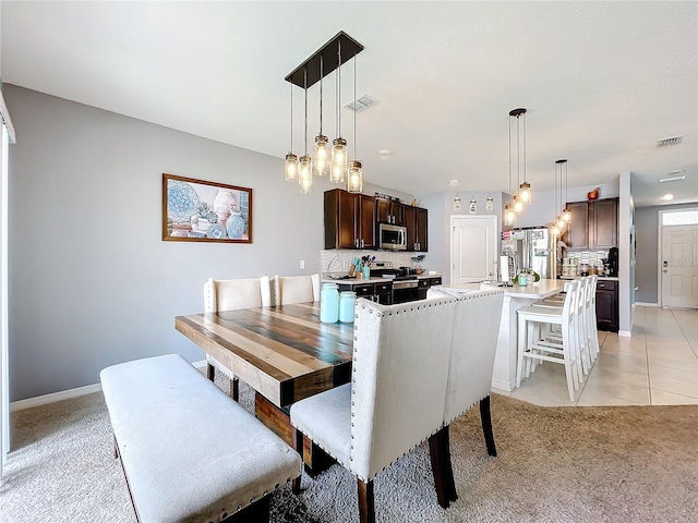 view of carpeted dining room