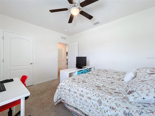 bedroom with ceiling fan and light colored carpet