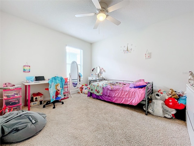 bedroom with carpet floors, a textured ceiling, and ceiling fan