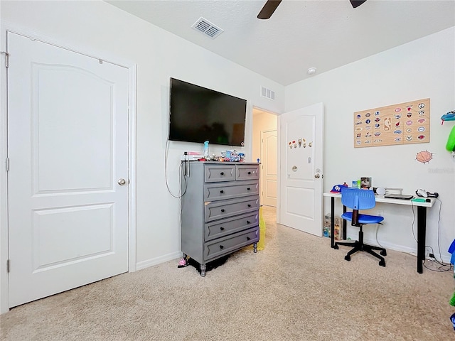 office space with light carpet and ceiling fan