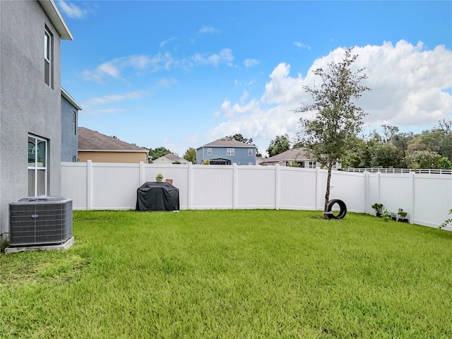 view of yard featuring central AC unit