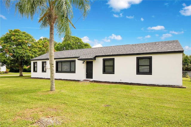 ranch-style house with a front yard