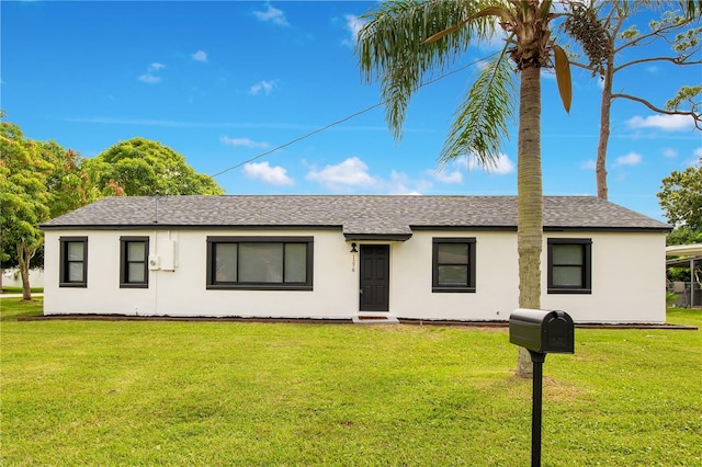 ranch-style house with a front lawn