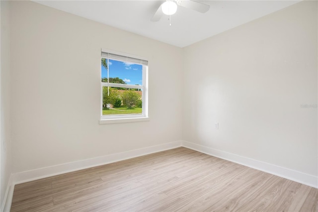 empty room with light hardwood / wood-style flooring and ceiling fan