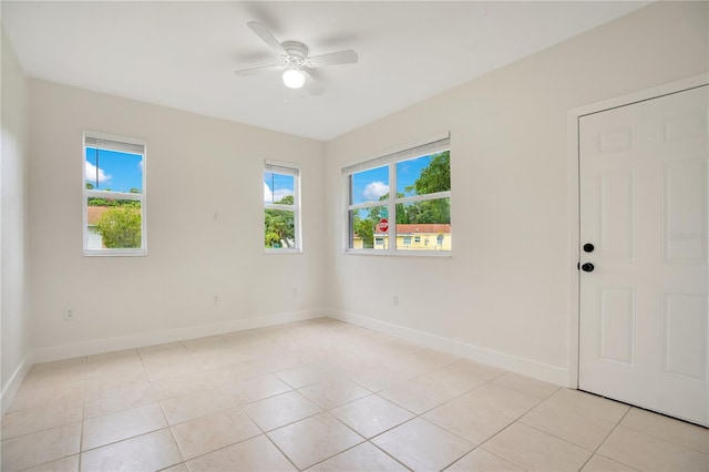 tiled empty room with ceiling fan