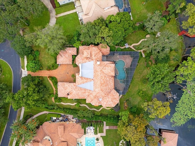 birds eye view of property with a water view