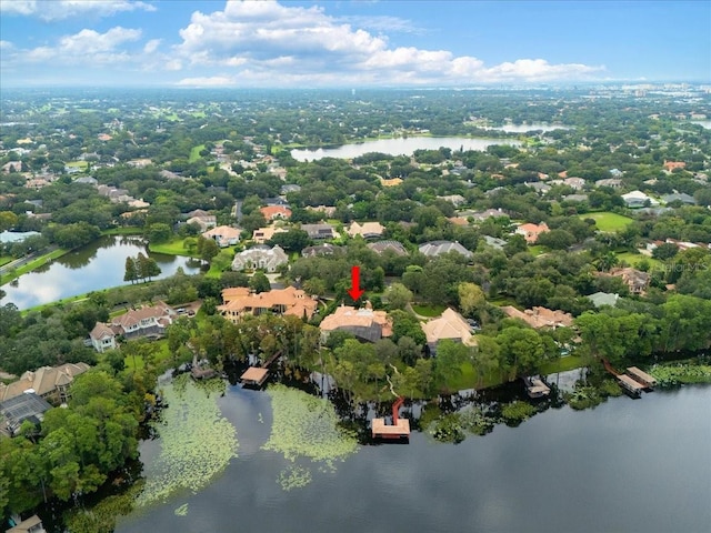 birds eye view of property with a water view