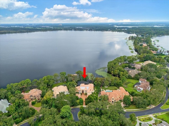 birds eye view of property with a water view