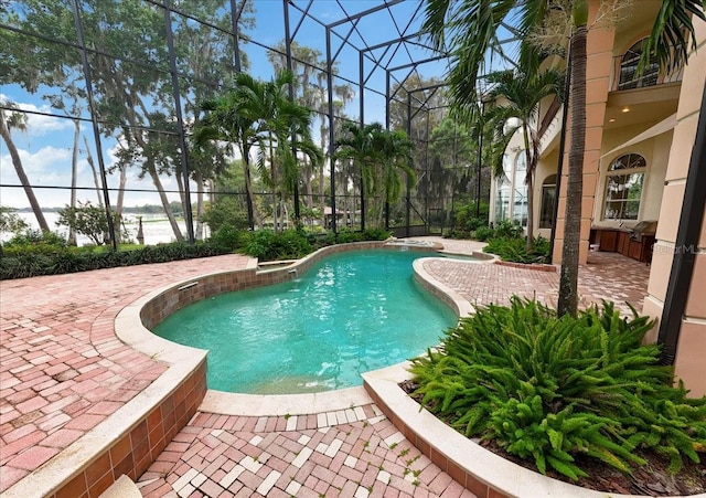 9164 Point Cypress Dr, Orlando, FL 32836 - swimming pool with a lanai and a patio area