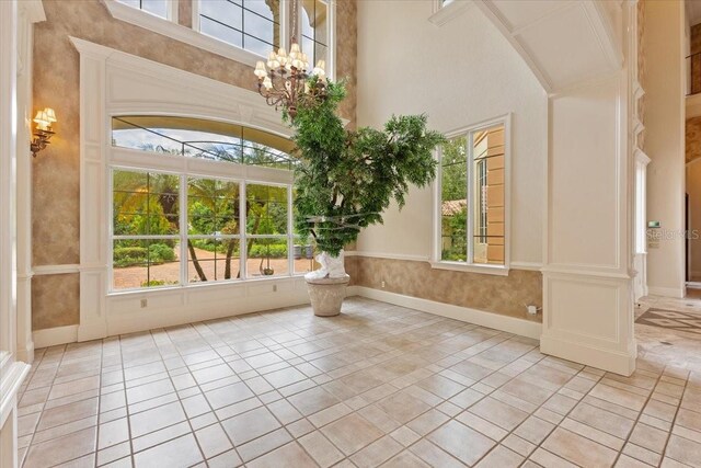 9164 Point Cypress Dr, Orlando, FL 32836 - entrance foyer with healthy amount of natural light and a chandelier