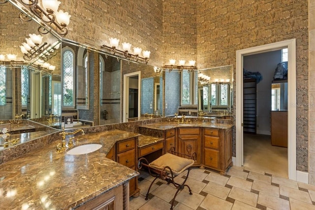 bathroom featuring vanity and a towering ceiling