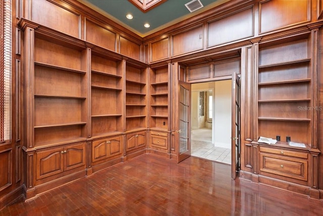 walk in closet featuring dark hardwood / wood-style flooring