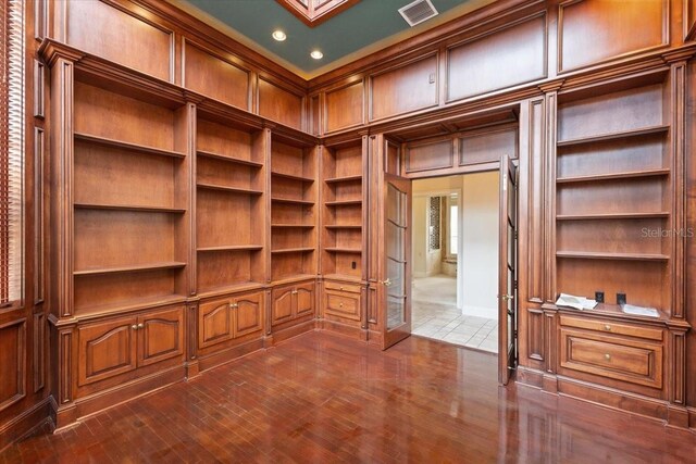 9164 Point Cypress Dr, Orlando, FL 32836 - unfurnished office featuring built in shelves, dark tile patterned floors, and recessed lighting