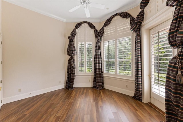 9164 Point Cypress Dr, Orlando, FL 32836 - spare room featuring a ceiling fan, wood finished floors, and crown molding