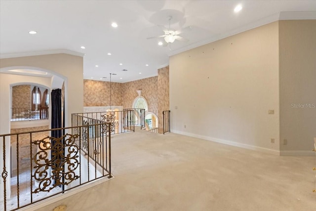 hallway featuring light carpet and crown molding