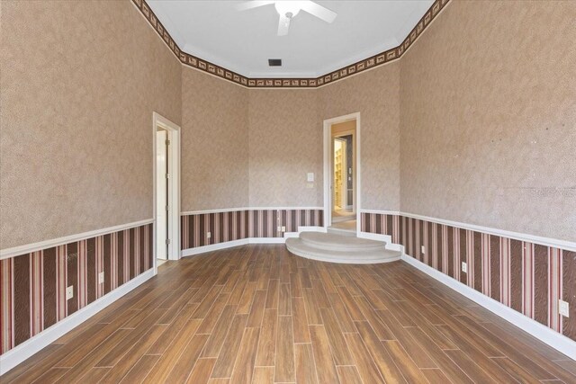 9164 Point Cypress Dr, Orlando, FL 32836 - spare room with wood finished floors and a ceiling fan