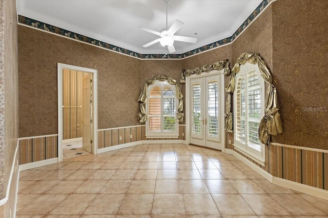 spare room with ceiling fan and ornamental molding