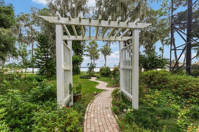 9164 Point Cypress Dr, Orlando, FL 32836 - view of green lawn featuring a lanai