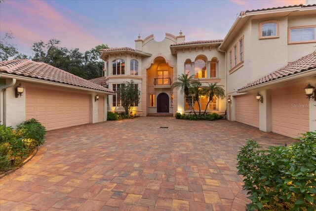 9164 Point Cypress Dr, Orlando, FL 32836 - mediterranean / spanish-style home with stucco siding and decorative driveway