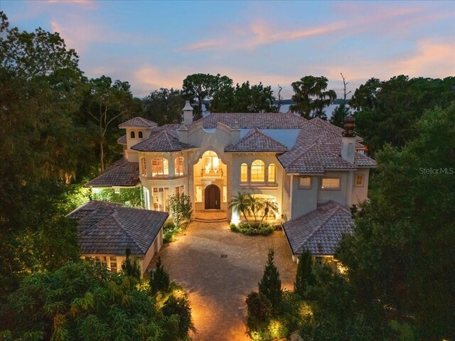 9164 Point Cypress Dr, Orlando, FL 32836 - mediterranean / spanish-style home featuring stucco siding and a chimney