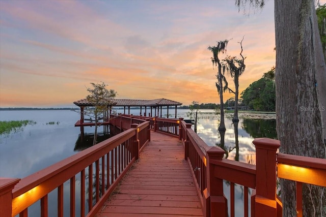 view of dock with a water view and a gazebo