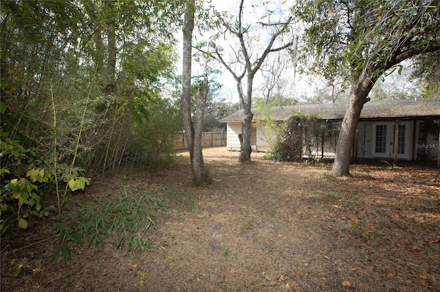 view of yard featuring french doors